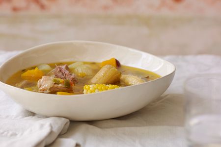Chock-full of smoked meats and native vegetables like corn, plantains, and squash, ajiaco is a mainstay of Cuban cooking.
