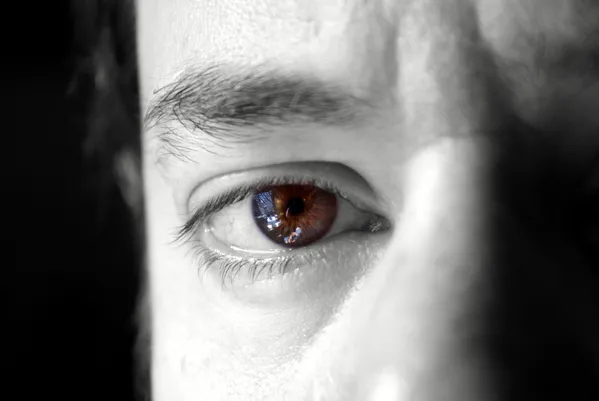 Brown eye against black and white, my husband's eye. thumbnail