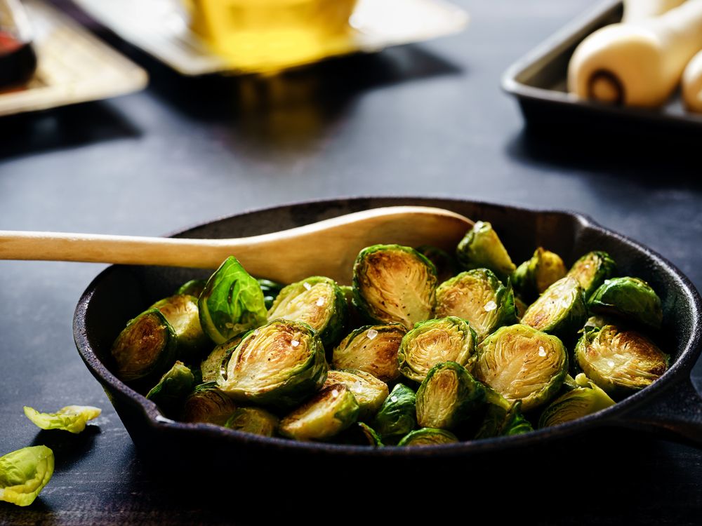 Cast iron skillet full of Brussels sprouts