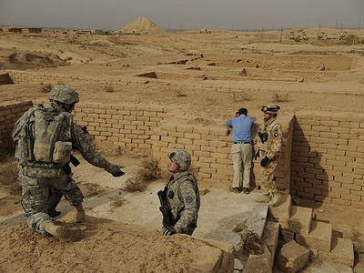 American soldiers in Nimrud in 2008, with the Ziggurat in the background.