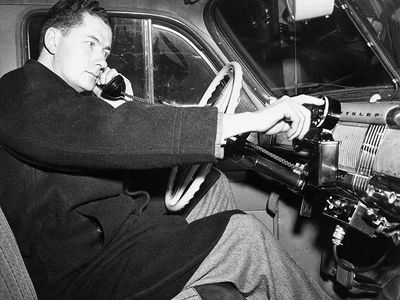 An engineer demonstrates a car phone five months before the historic first call on a competing company’s commercial mobile telephone service in 1946.