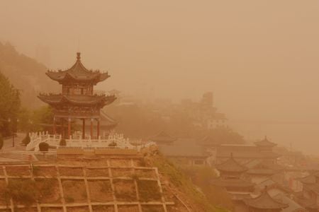 View of ancient buildings in a sandstorm in Lanzhou city, northwest Chinas Gansu province, 24 April 2014