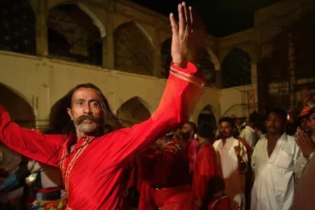 A Sufi pilgrim dances at the shrine of Lal Shahbaz Qalandar, in Sehwan Sharif, Pakistan, in 2006.