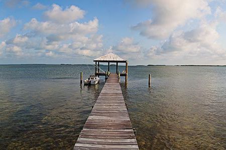 The turquoise water and mangrove islands seen from the dock sold the author on her Sugarloaf Key home.