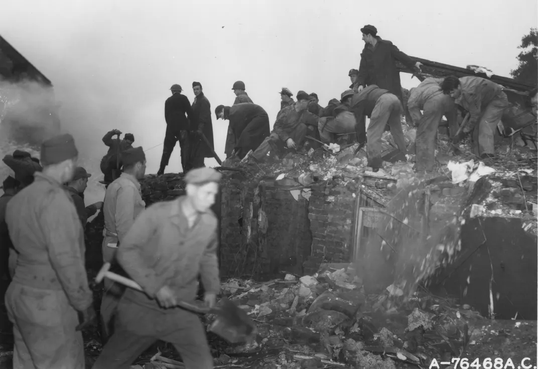 Ground personnel clear rubble from the Holy Trinity School in Freckleton, England.