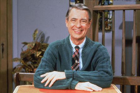 Fred Rogers, wearing his usual uniform of a cardigan and a tie, in the 1980s.