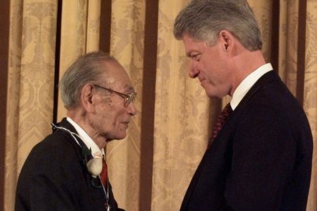 President Clinton presents Fred Korematsu with a Presidential Medal of Freedom during a ceremony at the White House Thursday, Jan. 15, 1998. Korematsu's legal challenges to civilian exclusion orders during World War II helped spur the redress movement for Japanese-Americans.