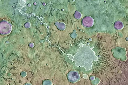 Image description via the Plantetary Science Institute: &quot;Loire Vallis (white line) is an outlet canyon that formed from the overflow of a lake in Parana Basin (outlined in white). Black lines indicate other valleys formed by processes other than lake overflows. Background is colored MOLA-derived topography over a THEMIS image mosaic. Image is approximately 650 kilometers across.&quot;