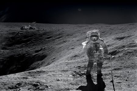 On their first Apollo 16 moonwalk, John Young and Charlie Duke (pictured) made their way to a crater named Plum. Their lunar rover waits in the background. Duke remembers the rover ride as bumpy, but stable.