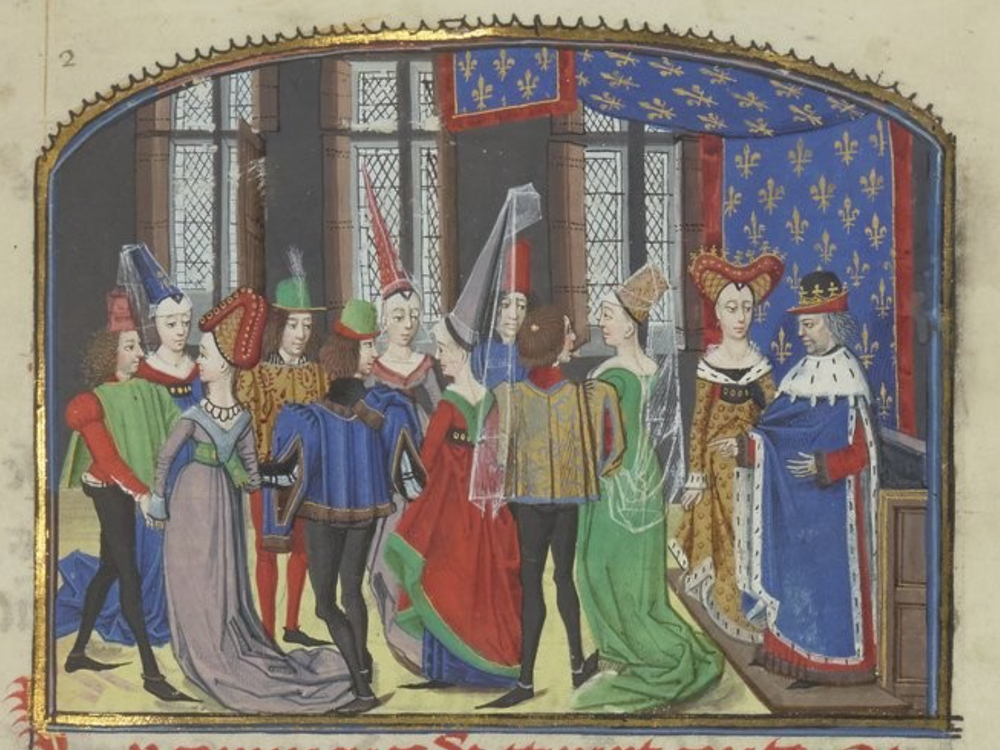 A colorful illuminated scene of young men and women, all in tall pointed hats and the men in tights and pointed shoes, gathered in front of two figures that appear to be a king and queen