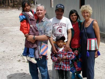 Rod (left, holding child) and Ingrid (far right) McCarroll of Alberta, shown here in central Mexico, have traveled the world helping to bring a cheap and effective water filtration system to many thousands of people.