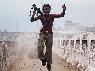 Chris Hondros, photographer for Getty Images News Services, captured this image of Joseph Duo and became a defining image of Liberia's protracted strife.