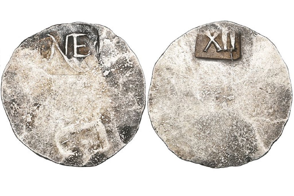 Simple coin with NE on one side and XII on the other