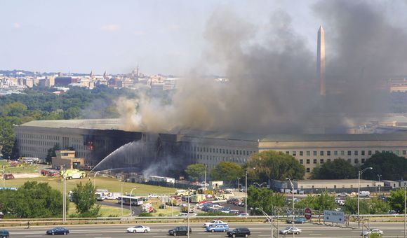 Smoke pours from the west wing of the Pentagon building September 11, 2001 in Arlington, Virginia, after a plane crashed into the building and set off a huge explosion. (Photo by Alex Wong/Getty Images)