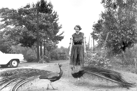 This 1962 photo shows author Flannery O'Connor in the driveway at Andalusia in Georgia.