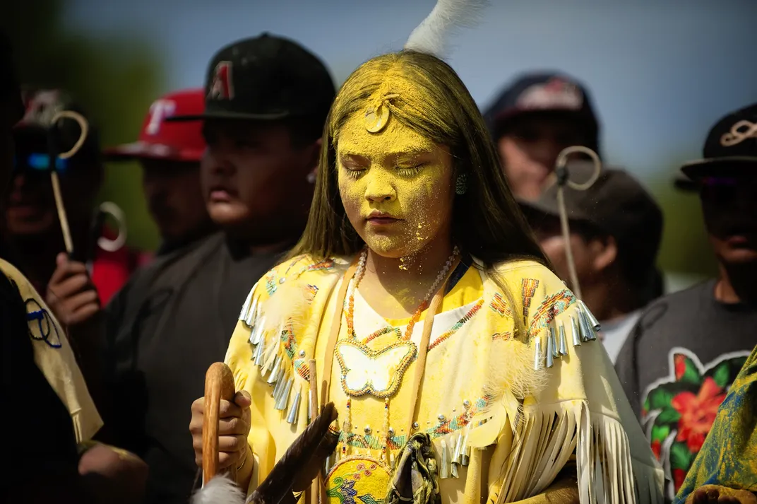 6 - At an Apache sunrise ceremony in San Carlos, Arizona, a girl’s passage to womanhood is marked. On this day, the people of her tribe say a blessing over her and sprinkle her with pollen.