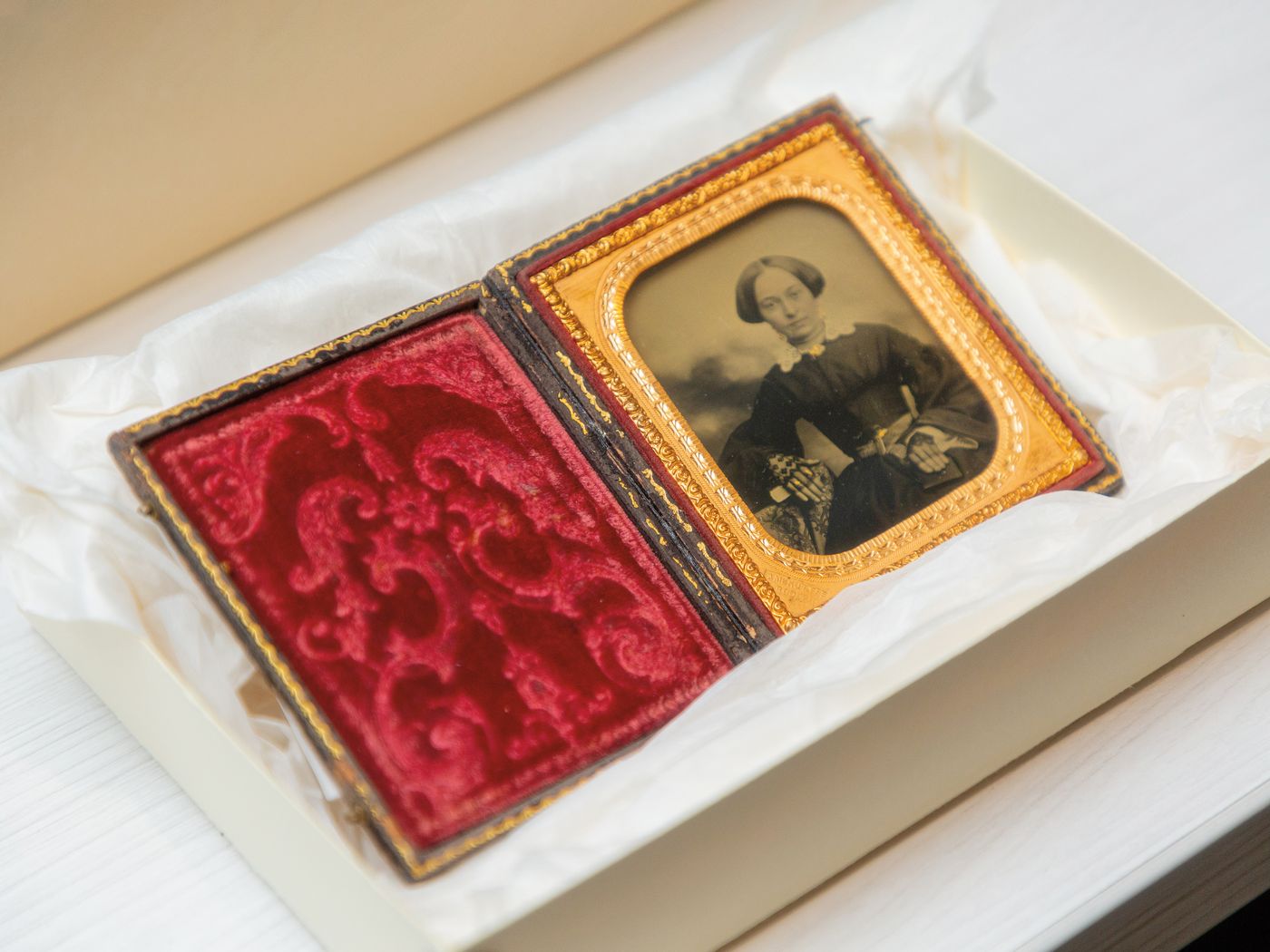 a photograph of a daguerreotype sitting in a box