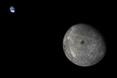 A view of the Earth-Moon system from the Chang’E 5 Test mission.  The large dark area near the center of the Moon’s far side is Mare Moscoviense.