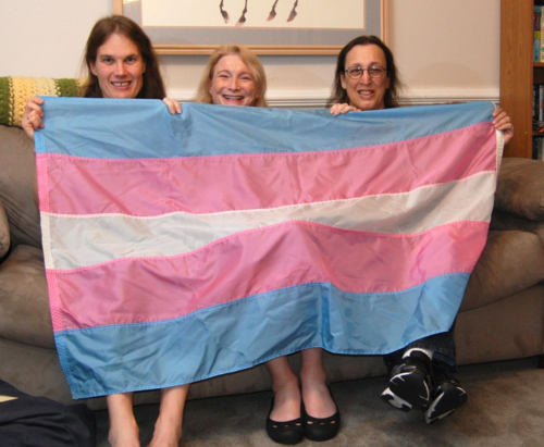 Transgender flag designed by Monica Helms (right), and friends. The flag's stripes represent the traditional pink and blue associated with girls and boys and white for intersex, transitioning, or of undefined gender. Helms served in the United States Navy and became an activist for transgender rights in the late 1990s in Arizona where she grew up. She designed the flag in 1999. (NMAH)