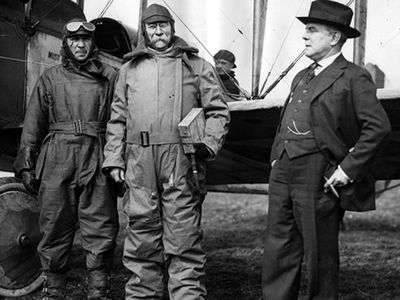 From left to right, Airmail Pilot Robert Shank; Dr. Julius Juhlin, postmaster general of Sweden; and Second Assistant Postmaster General Otto Praeger pose for a photograph at the Washington, D.C., airfield in College Park, Maryland, on March 8, 1919.