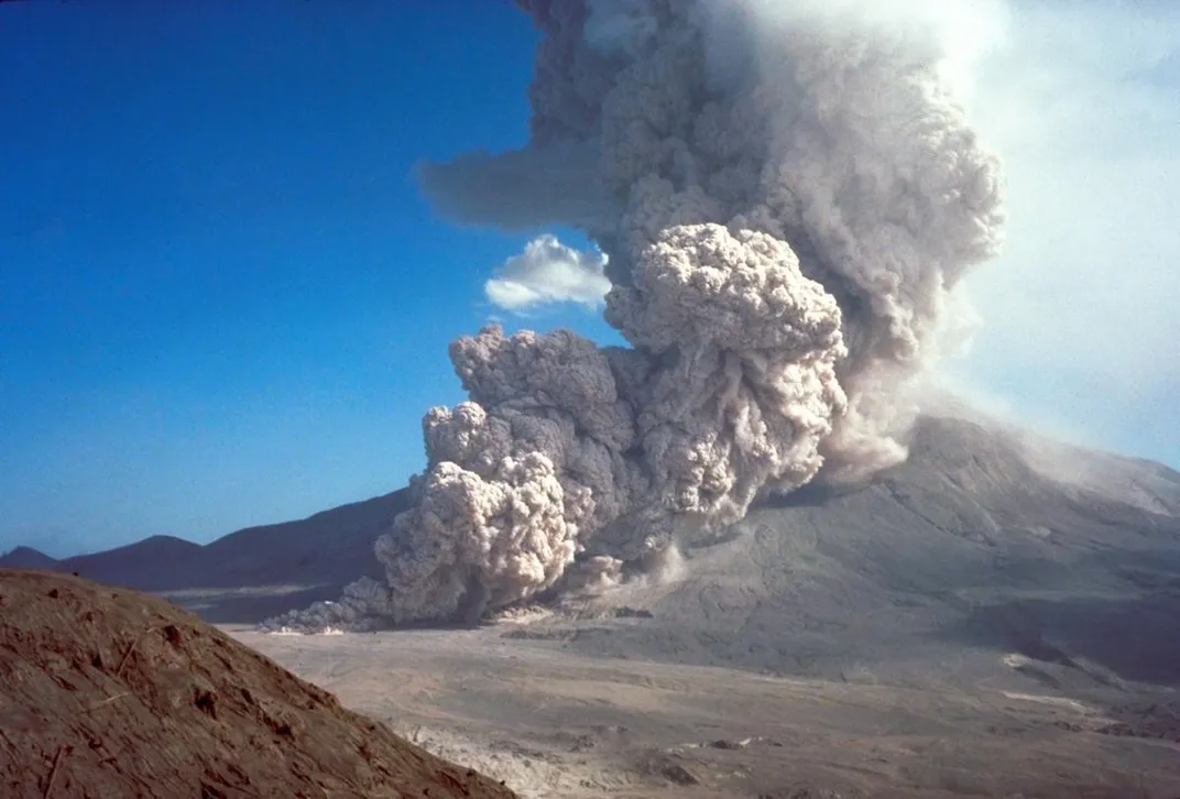 A cloud of ash and rock spews out of an erupting volcano.