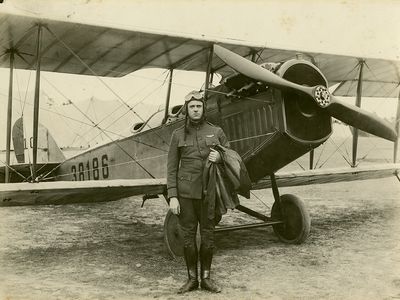 We know that Elmo Pickerill, here with a Curtiss JN-4H Jenny, was a U.S. Army Air Service lieutenant in 1918. About his claims to earlier flights, we’re not so sure.