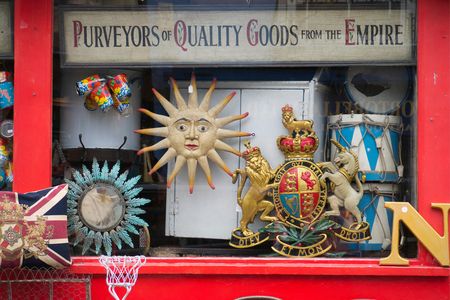 A shop sells nostalgic souvenirs, including a UK coat of arms, at the Portobello Road market in London.