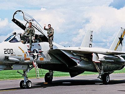 Dale Snodgrass is known as a virtuoso of the F-14 (left, with squadron ops officer Dirk Hebert at right, in 1990).