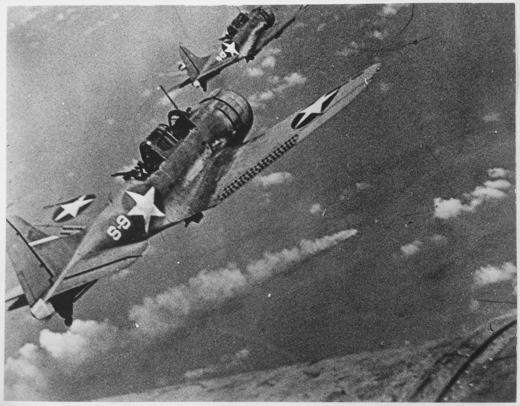 American dive bombers approach the Japanese heavy cruiser Mikuma ​​​​​​​during the Battle of Midway in June 1942.