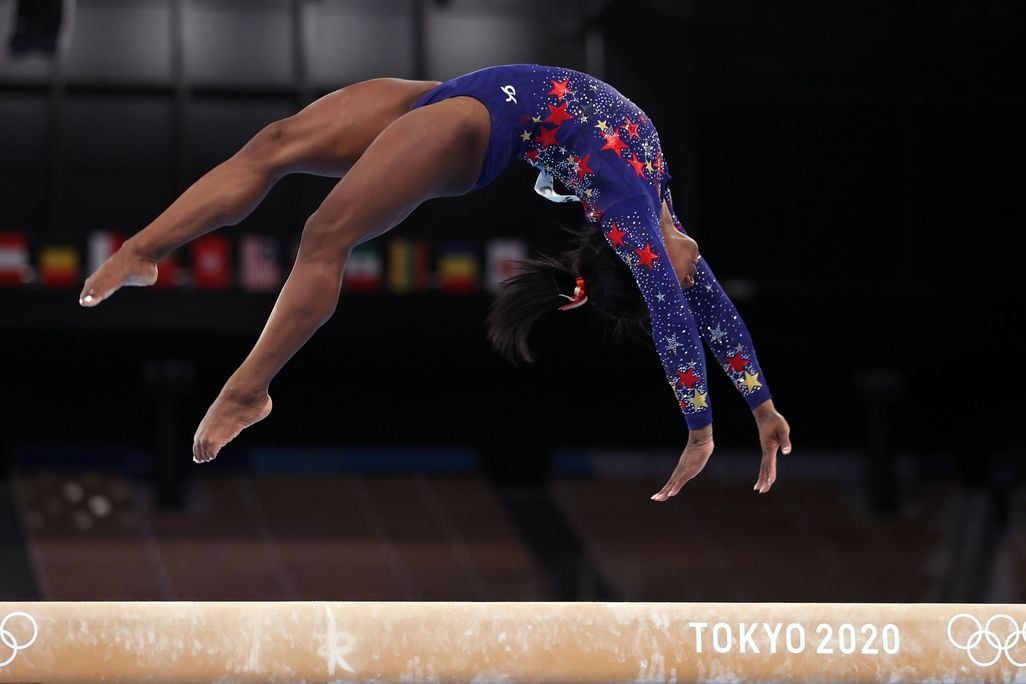 Simone Biles competes on the balance beam at the Tokyo 2020 Olympics