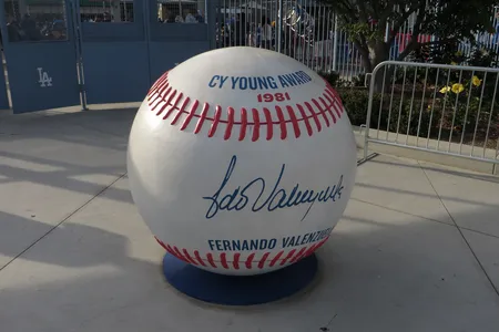 The meteoric rise of Fernando Valenzuela, a left-handed pitcher (above: a monument at Dodger Stadium) from the rural town of Etchohuaquila in Sonora, Mexico, won the hearts of Latina and Latino audiences