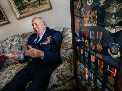A display of some of the medals awarded to Emmett Davis (in his home, in 2012) sums up a long, exemplary career.
