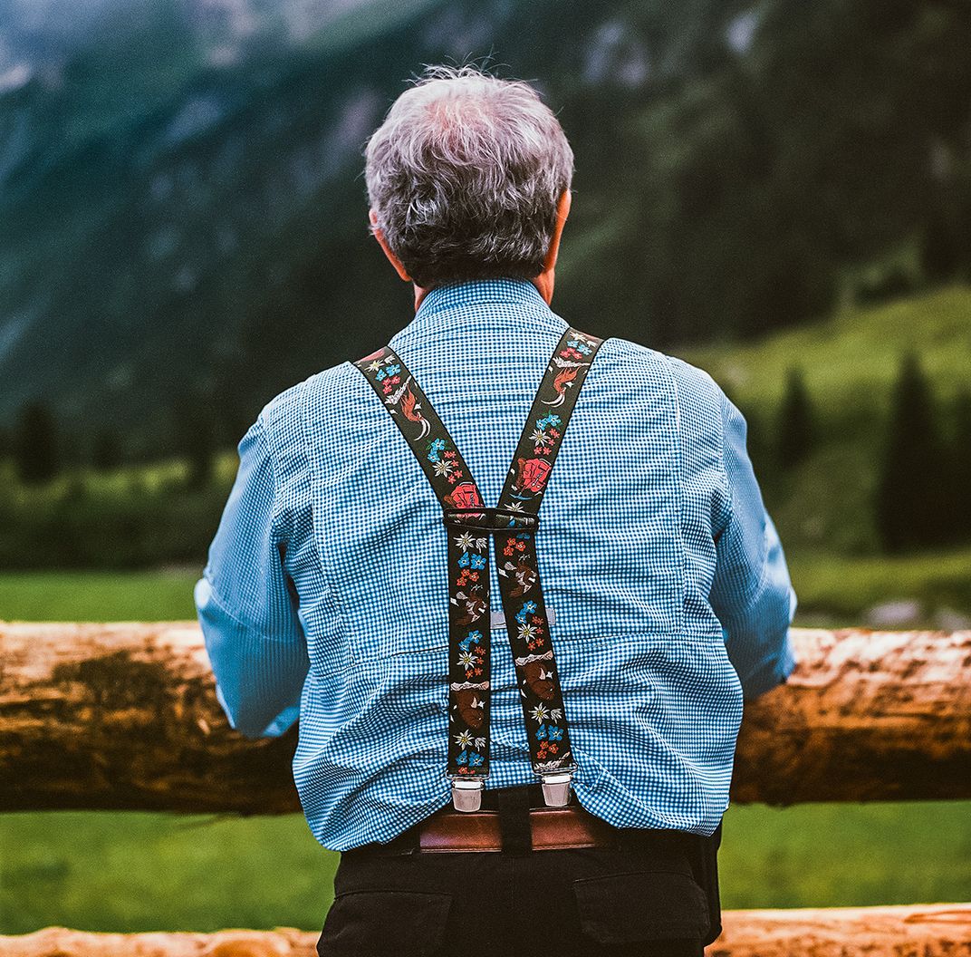 A hiker takes in the view from the Krimmler Tauernhaus before the hike.