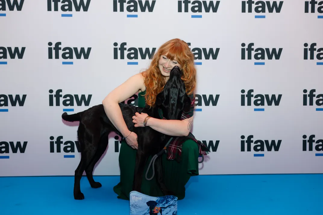 Person hugging a dog