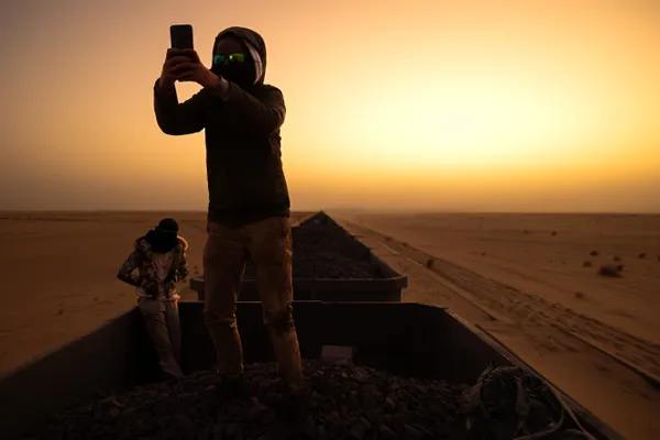 Tramping the Sahara at sunrise thumbnail