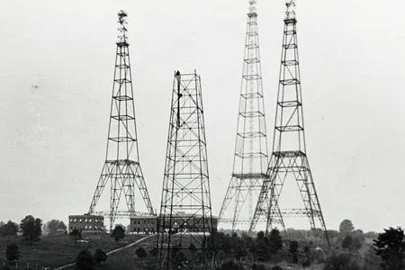 Radio towers like these, clustered on a hillside in Arlington, Virginia in the 1920s, have been leaking signals into space for decades. Our neighbors could be listening. 