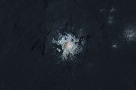 The bright spots of Occator Crater are shown in enhanced color in this view from NASA's Dawn spacecraft.