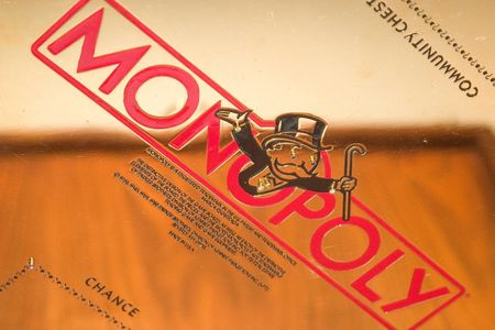 Artist and Jeweler Sidney Mobell donated his gold-plated Monopoly set to the National Museum of Natural History in 2002. (Smithsonian Institution)