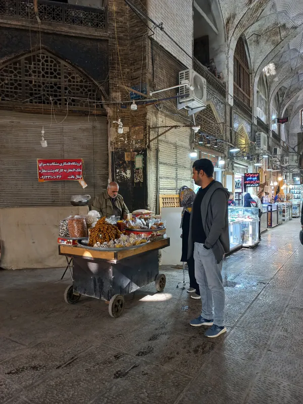 A vendor with a pushcart is bringing life to the heart of the market. thumbnail