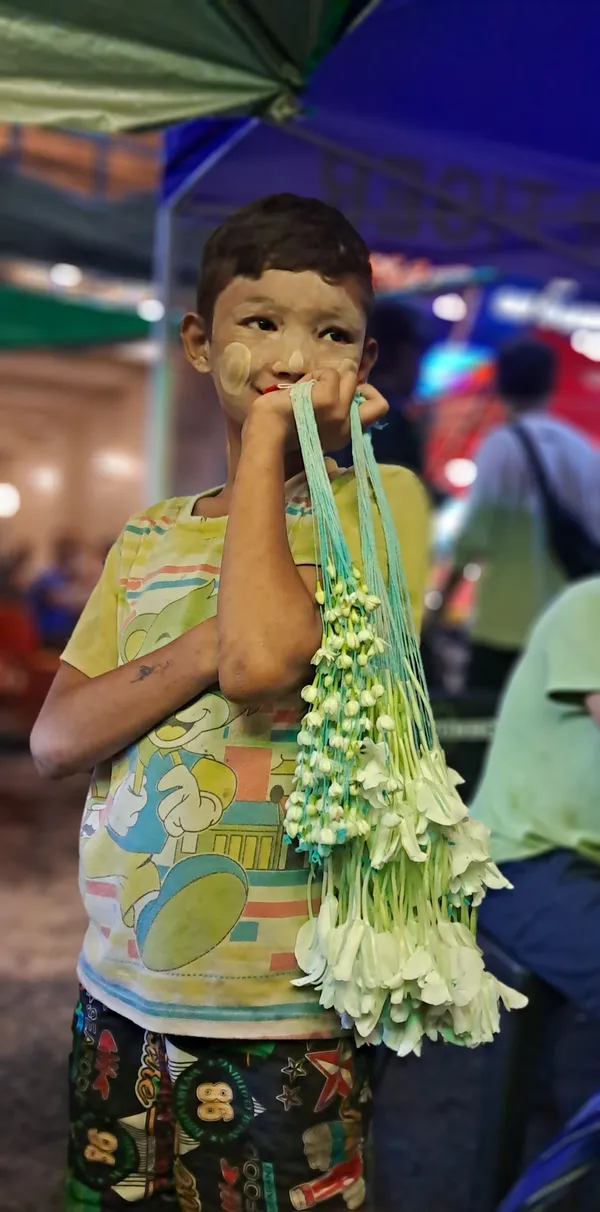 Young Flowers Seller in Yangon street thumbnail