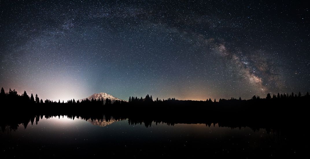 Panoramic image of the Milky Way arcing over Mount Shasta ...