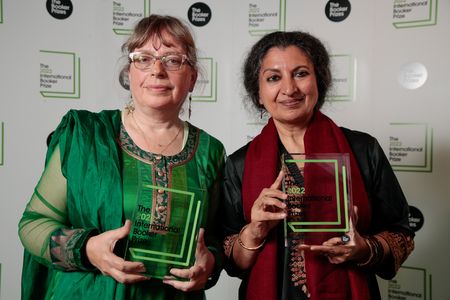 Translator Daisy Rockwell and author Geetanjali Shree hold their International Booker Prize awards.