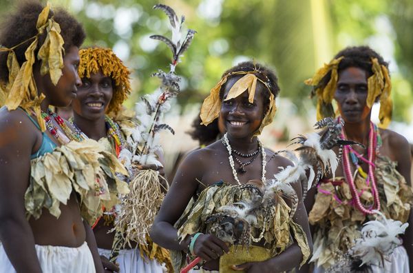 Village women enjoy a traditional dance in the Solomon Islands. thumbnail