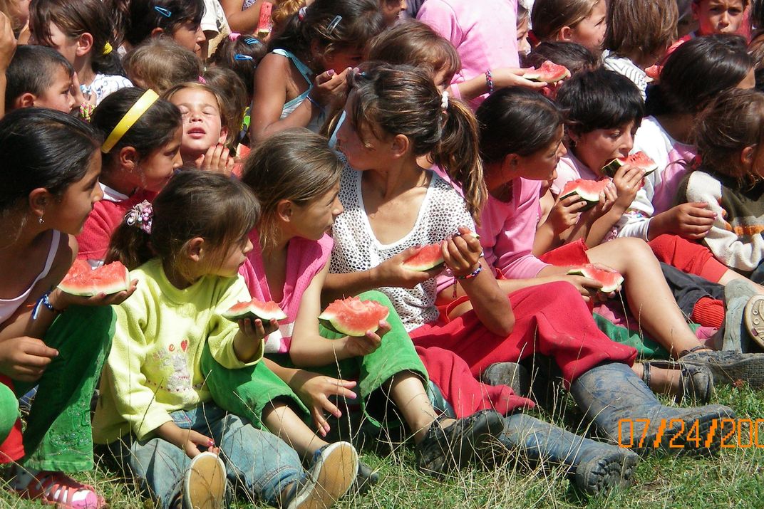 Gypsy children enjoying a cool treat on a hot summer day in Romania ...