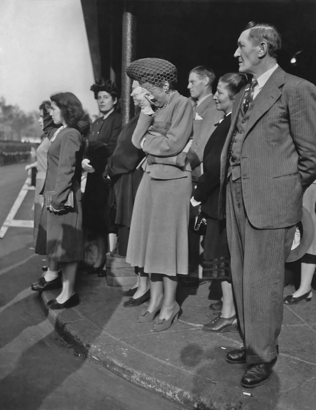 A crowd watches as the procession makes its way through New York City on October 26, 1947.