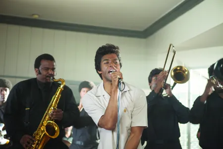 Craig Robinson, left, as Maceo Parker and Chadwick Boseman as James Brown in "Get on Up", the incredible life story of the Godfather of Soul, from director Tate Taylor.
