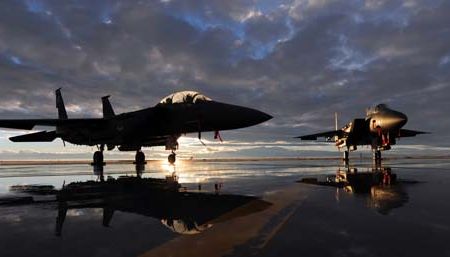 Two F-15E Strike Eagles sit on the flightline during sunset Dec. 6, 2010, at Mountain Home Air Force Base, Idaho. The aircraft are assigned to the 391st and 389th Fighter Squadrons.  (U.S. Air Force photo/Senior Airman Debbie Lockhart)