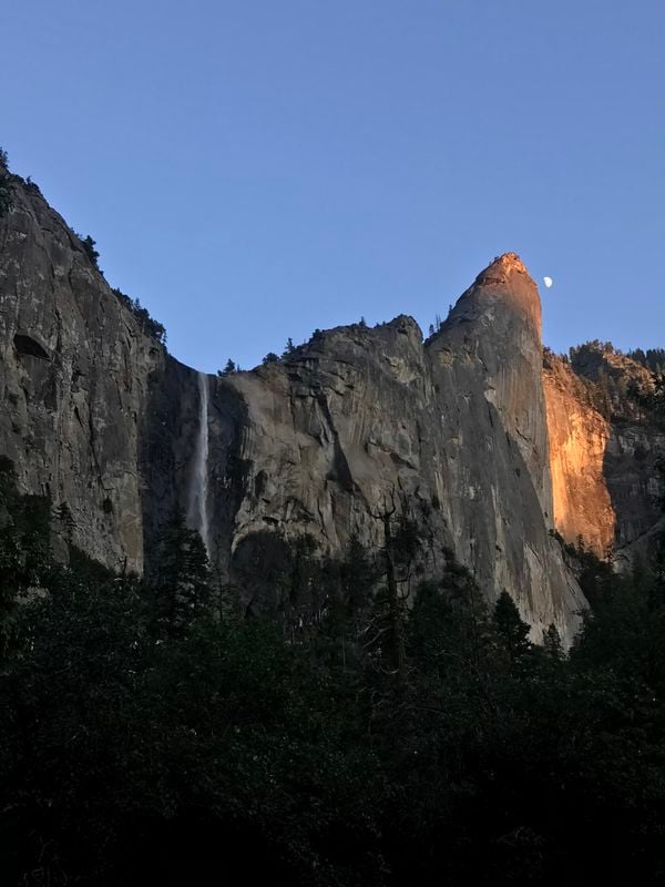Moon overlooking Bridalveil fall in Yosemite thumbnail