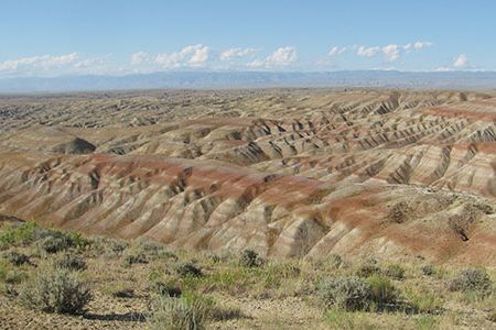 The badlands north of Worland, Wyoming, shown here, expose sediments deposited during the Paleocene-Eocene Thermal Maximum.