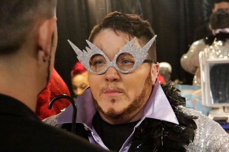 A close up of Kody's face, featuring large, sparkly, silver glasses.